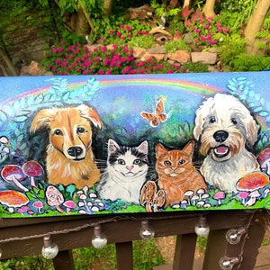 May include: A blue mailbox painted with a whimsical scene of a dog, two cats, and mushrooms. The mailbox has a rainbow painted across the top.