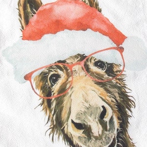 May include: A whimsical illustration of a donkey wearing a red Santa hat and red-framed glasses. The donkey has a friendly expression, with a slight smile. The artwork is set against a white background.
