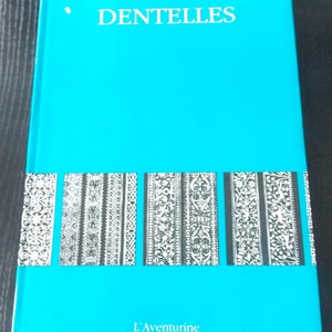 May include: A turquoise blue book with the title "Dentelles" and the publisher's name "L'Aventure" printed in white. The book cover features a row of six black and white illustrations of lace patterns.
