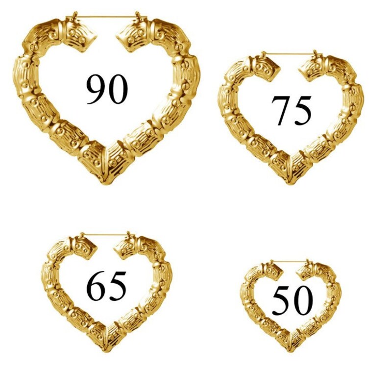 May include: Four gold heart-shaped hoop earrings in different sizes: 90, 75, 65, and 50. The earrings are made of a textured metal that resembles bamboo.