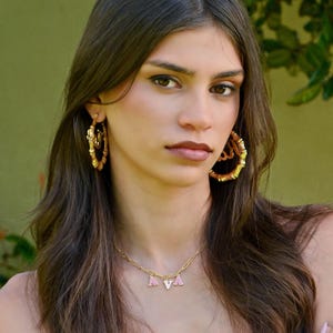 Custom candy letter name necklace with colorful enamel bubble letters on gold paperclip chain choker