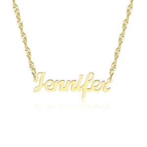 May include: A gold-colored necklace with the name "Jennifer" in a cursive font. The pendant is attached to a twisted rope chain. The necklace is displayed against a white background.