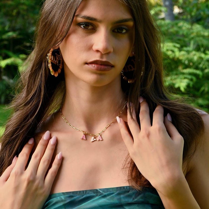 Trendy colorful enamel name necklace styled as statement choker jewelry