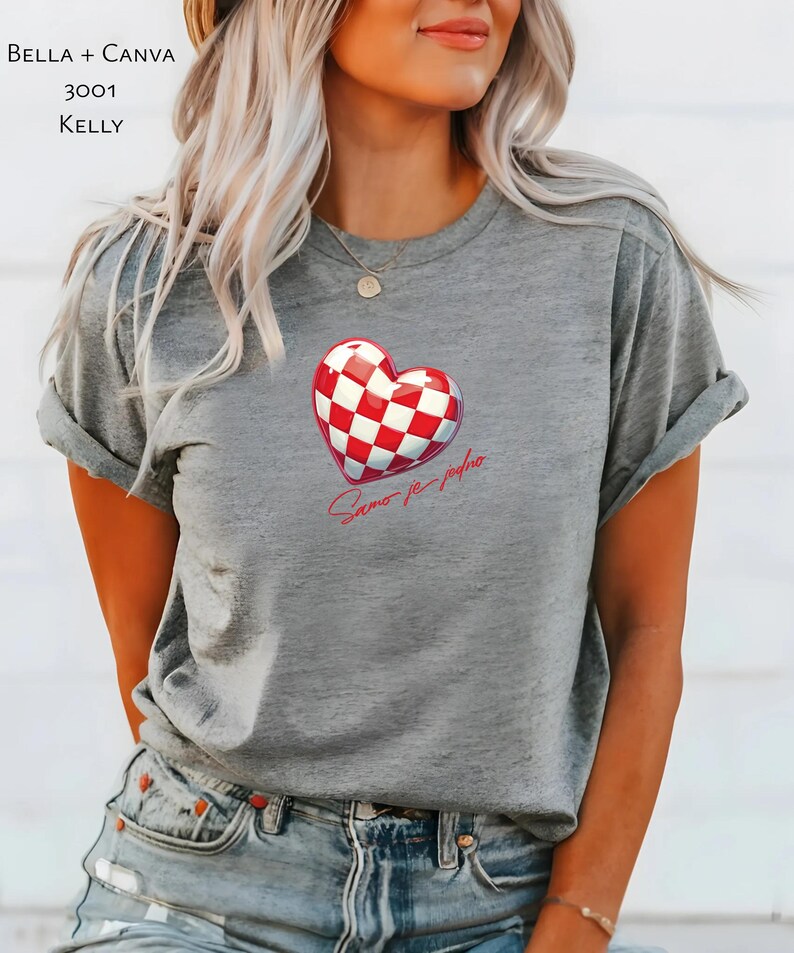 May include: Grey t-shirt with a red and white chequered heart and the text "Samo je jedno" in red.