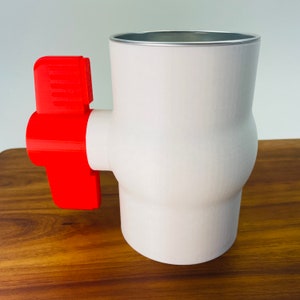 May include: White plastic ball valve with a red handle. The valve has a silver rim around the top.