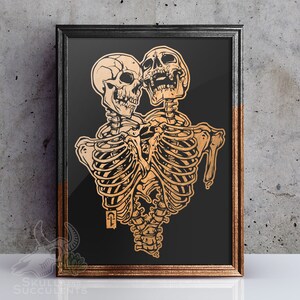 May include: Two gold skeletons with ribcages and skulls are embracing each other. The skeletons are on a black background.