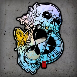 May include: A black and white illustration of a skull, butterfly, and clock face. The skull is iridescent and has a floral design behind it. The clock face has Roman numerals and a black hand.