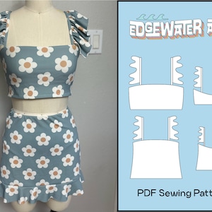 May include: A blue and white floral crop top and skirt sewing pattern. The pattern includes instructions for making a crop top with ruffle sleeves and a skirt with a ruffle hem. The pattern is titled "Edgewater Ave" and is available as a PDF download.
