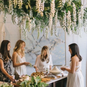 Detail of white wisteria flower clusters on artificial garland for event decor