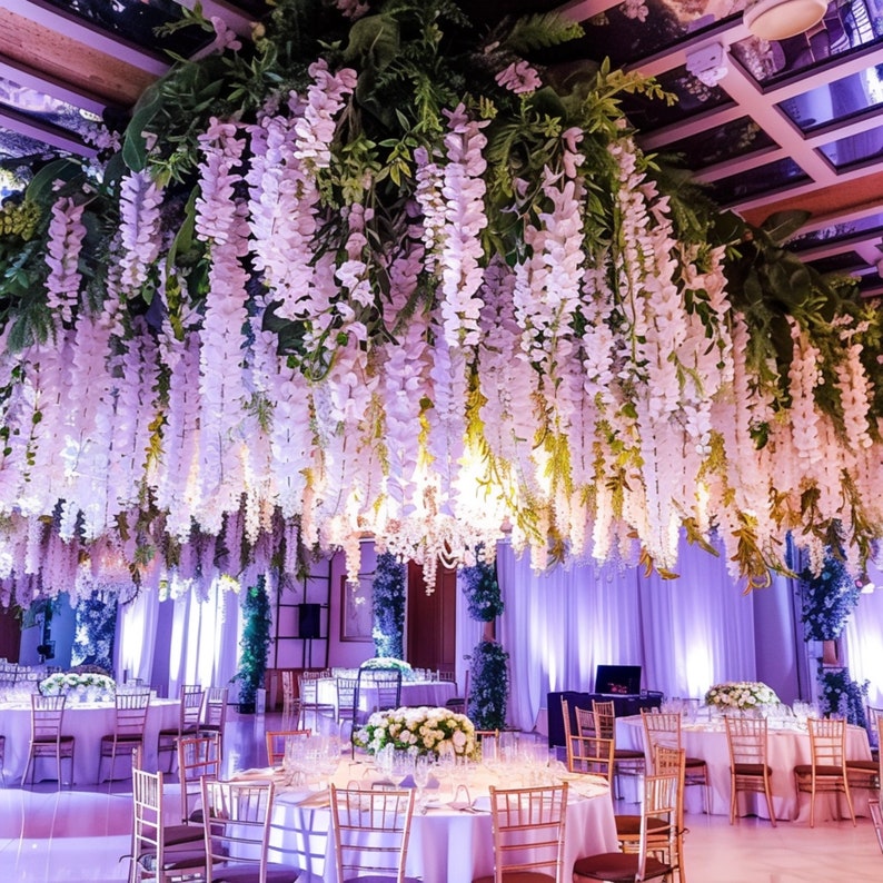 Detail of white wisteria flower clusters on artificial garland for event decor