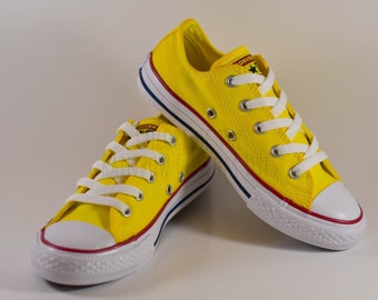 pastel yellow converse high tops