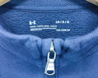 Suéter holgado azul marino con cuello con cremallera y bordado de