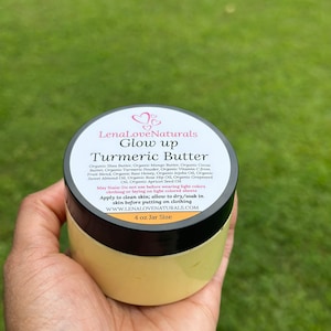 May include: A 4 ounce jar of turmeric butter labeled "LenaLoveNaturals Glow up Turmeric Butter". The jar is yellow and has a black lid. The label lists the ingredients, which include shea butter, mango butter, cocoa butter, turmeric powder, vitamin C, raw honey, jojoba oil, sweet almond oil, rose hip oil, grapeseed oil, and apricot seed oil. The label also states that the product may stain and should not be used before wearing light colors. It instructs the user to apply the butter to clean skin and allow it to dry or soak in before putting on clothing. The website address is listed as www.lenalovenaturals.com.