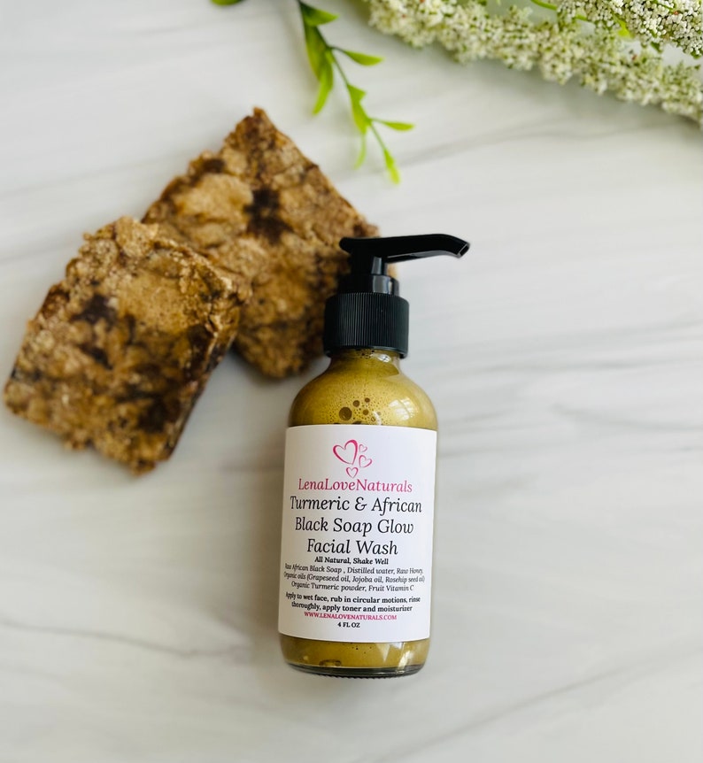May include: A 4 fl oz bottle of LenaLove Naturals Turmeric & African Black Soap Glow Facial Wash. The bottle is gold with a black pump top and a white label with pink hearts. The label reads "LenaLove Naturals Turmeric & African Black Soap Glow Facial Wash All Natural, Shake Well"