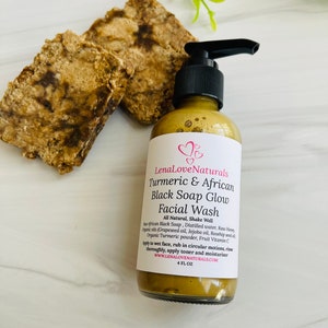 May include: A 4-ounce bottle of LenaLoveNaturals Turmeric & African Black Soap Glow Facial Wash. The bottle is amber glass with a black pump top. The label is white with pink hearts and black text. The product is all-natural and contains African Black Soap, distilled water, raw honey, grapeseed oil, jojoba oil, rosehip seed oil, organic turmeric powder, and fruit vitamin C.