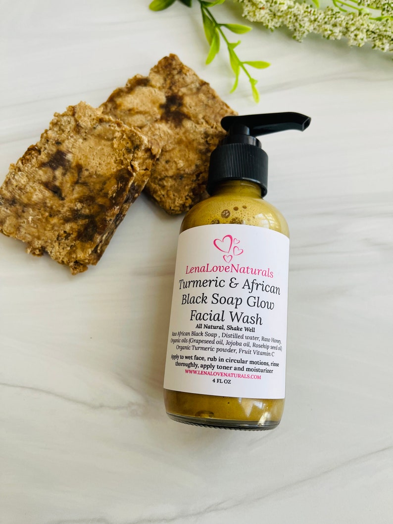 May include: A 4-ounce bottle of LenaLoveNaturals Turmeric & African Black Soap Glow Facial Wash. The bottle is amber glass with a black pump top. The label is white with pink hearts and black text. The product is all-natural and contains African Black Soap, distilled water, raw honey, grapeseed oil, jojoba oil, rosehip seed oil, organic turmeric powder, and fruit vitamin C.