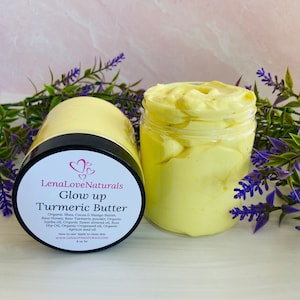May include: A glass jar filled with a yellow turmeric butter. The jar has a black lid and a white label that reads "LenaLoveNaturals Glow up Turmeric Butter". The label lists the ingredients, instructions for use, and the website address.