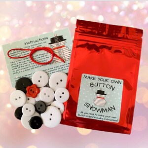 May include: A craft kit to make your own button snowman. The kit includes a variety of black and white buttons, red buttons, and a length of string. The instructions are printed on a card with a picture of a snowman made of buttons.