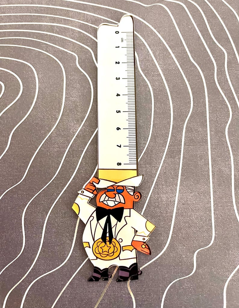 May include: A white ruler with black markings up to 8 cm, attached to a cartoon character wearing a white suit, yellow hat, and a black bow tie. The character is holding a gold star medal.