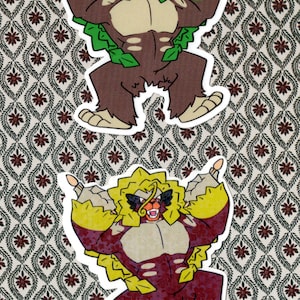 May include: Two stickers depicting a cartoon ape-like creature in a dynamic pose. The top sticker has green foliage, while the bottom one has yellow and red accents. The background features a patterned design.