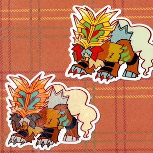 Puede incluir: Dos pegatinas con una criatura de dibujos animados con una melena amarilla, naranja y roja, pelaje marrón y cola blanca. La criatura está de pie sobre sus cuatro patas con la cabeza inclinada hacia abajo.