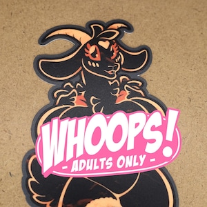 May include: A black sticker featuring a cartoon goat-like character with orange accents. The sticker has a pink oval with the words "WHOOPS!" and "ADULTS ONLY" in white text. Other stickers are visible in the background.