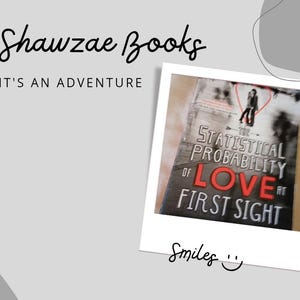 May include: A book titled "The Statistical Probability of Love at First Sight" with a red heart and a couple standing in the background. The book cover has a white background with black text and a red heart.