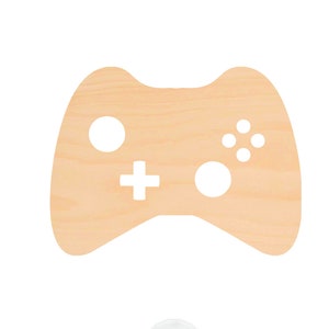 May include: A wooden cutout of a video game controller. The controller is light brown and has a white outline. The controller has a plus sign, a circle, and four dots on it.