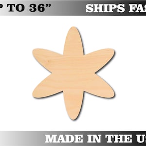 May include: A wooden cutout of a six-pointed star shape, resembling a flower. The cutout is made of light-colored wood and is approximately 36 inches in size.