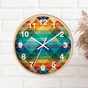 May include: A colorful clock with a geometric design. The clock face has a background of blue, green, yellow, orange, and red stripes. The numbers 1 through 12 are printed in white on the clock face.