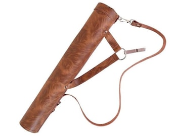 May include: A brown leather archery quiver with a textured pattern. The quiver has a shoulder strap and a belt loop. The quiver is designed to hold arrows and is made of durable leather.