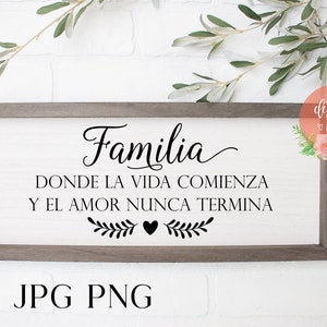 May include: A framed wooden sign with the text "Familia Donde la Vida Comienza Y El Amor Nunca Termina" in black lettering. The sign features a small heart and leafy branches.