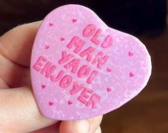 Old Man Yaoi Enjoyer , Holographic Heart Shaped Badge in PINK