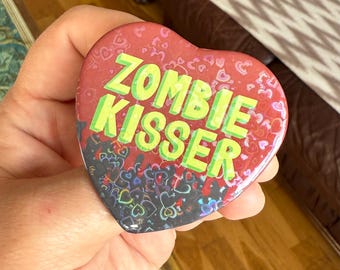 Zombie Kisser , Holographic Heart Shaped Badge , inspired by Cesare from Bigtop Burger