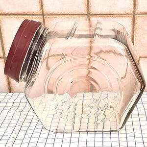 May include: A trio of ceramic mugs with a speckled, matte finish in cream, light grey, and dark grey. Each mug features a simple, minimalist design, ideal for tea or coffee.