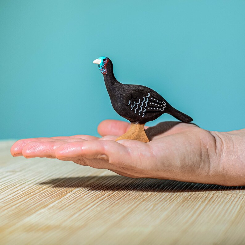 Wooden Turkey Hen Figurine held in hand, tactile and eco-friendly Montessori toy