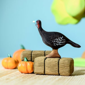 Wooden Turkey Hen Toy on rustic wooden blocks, autumnal Montessori learning aid