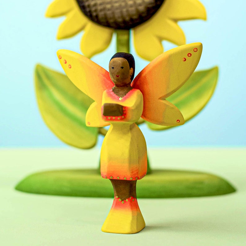 Montessori wooden play sunflower with a colorful fairy figure for educational and creative play