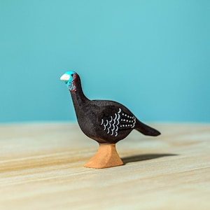 Handcrafted Wooden Turkey Hen Figurine on wooden surface, Montessori play for natural learning