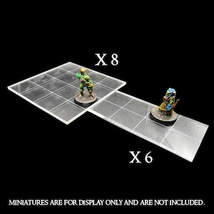 Può includere: Due tessere da gioco in acrilico trasparente con un motivo a griglia. La tessera più grande ha 8 quadrati e la tessera più piccola ha 6 quadrati. Le tessere sono etichettate "X8" e "X6".