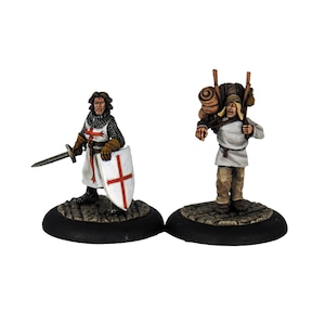 May include: Two painted miniature figures, one a knight in chainmail and a white tunic with a red cross, holding a sword and shield, the other a peasant carrying a large pack on their back.
