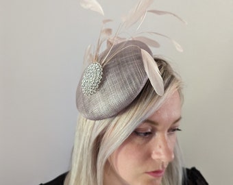 Large mink coloured fascinator with a spray of matching feathers finished with a large broach perfect for a wedding special occasion races