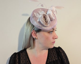 Soft blush sloped pillbox fascinator with silk ranunculus flowers and matching feathers wedding special occasion races ladies day
