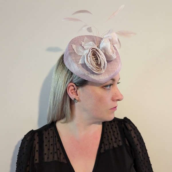 Soft blush sloped pillbox fascinator with silk ranunculus flowers and matching feathers wedding special occasion races ladies day