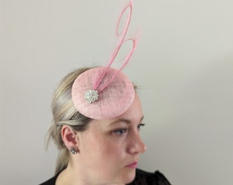 Pink button base fascinator with a double curled pheasant feather and small broach Wedding Races Special Occasion