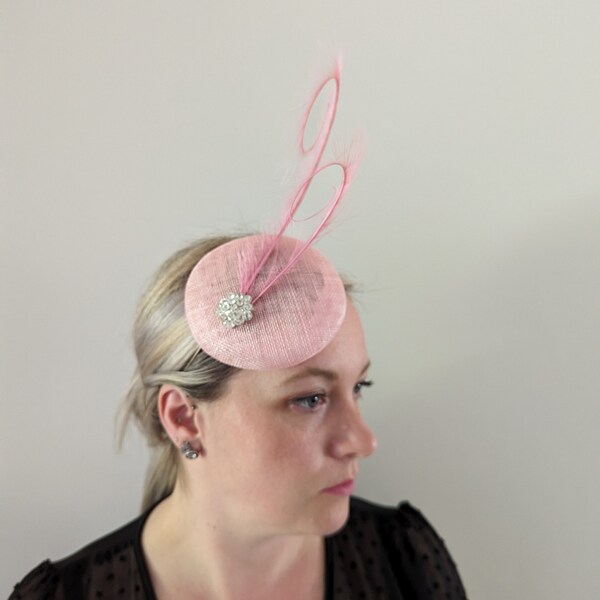 Pink button base fascinator with a double curled pheasant feather and small broach Wedding Races Special Occasion