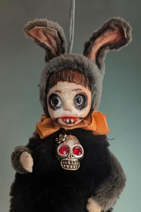 A handmade creepy rabbit art doll that straddles the line between adorable and unsettling — exactly the energy Halloween and gothic decor collectors crave.