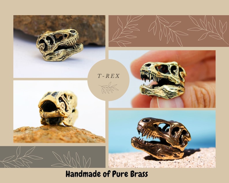 May include: Four close-up images of a gold-colored T-Rex dinosaur skull charm. The charm is made of brass and has a detailed design. The text "T-REX" is visible in the image. The text "Handmade of Pure Brass" is also visible in the image.