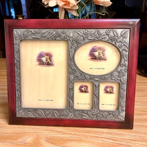 May include: A multi-photo picture frame with a burgundy wood finish and a decorative silver-colored metal border. The frame holds four photos of varying sizes, with a grape and leaf design. The largest photo area is 5" x 7" (13cm x 18cm).