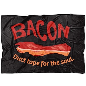 May include: Black fleece blanket with the word "BACON" in red lettering and a cartoon image of a strip of bacon. The text below the bacon reads "Duct tape for the soul."